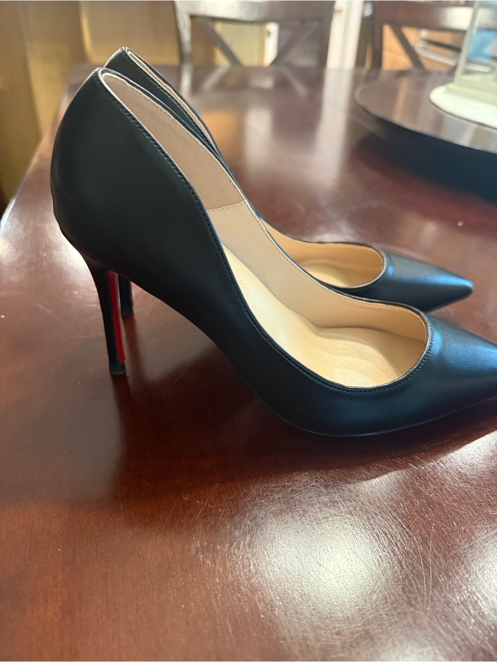 Black Leather Pointed-Toe Pumps with Red Soles